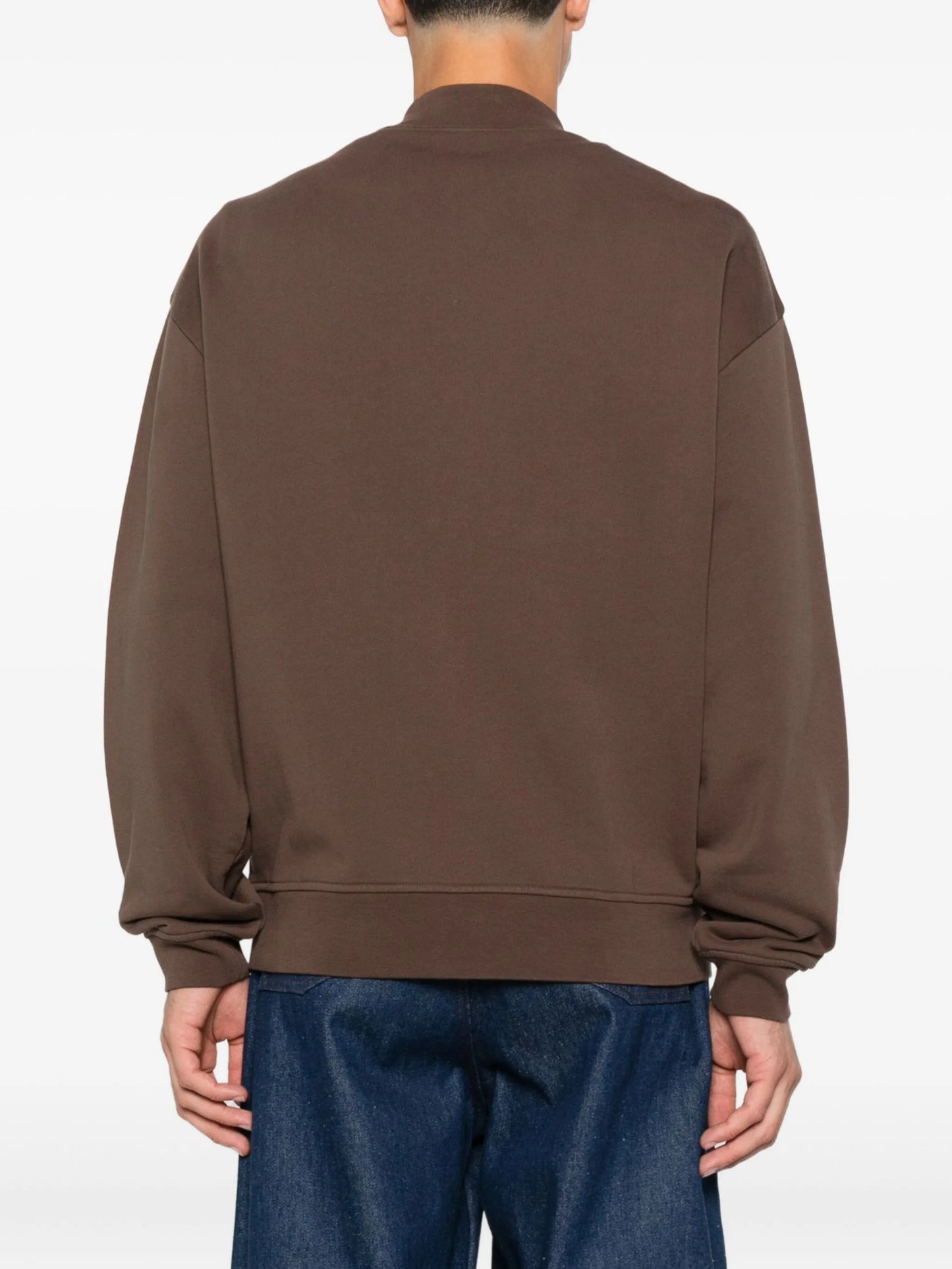 Brown jacket with a visible brand label on a white background