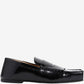 Black loafer shoe on a white background
