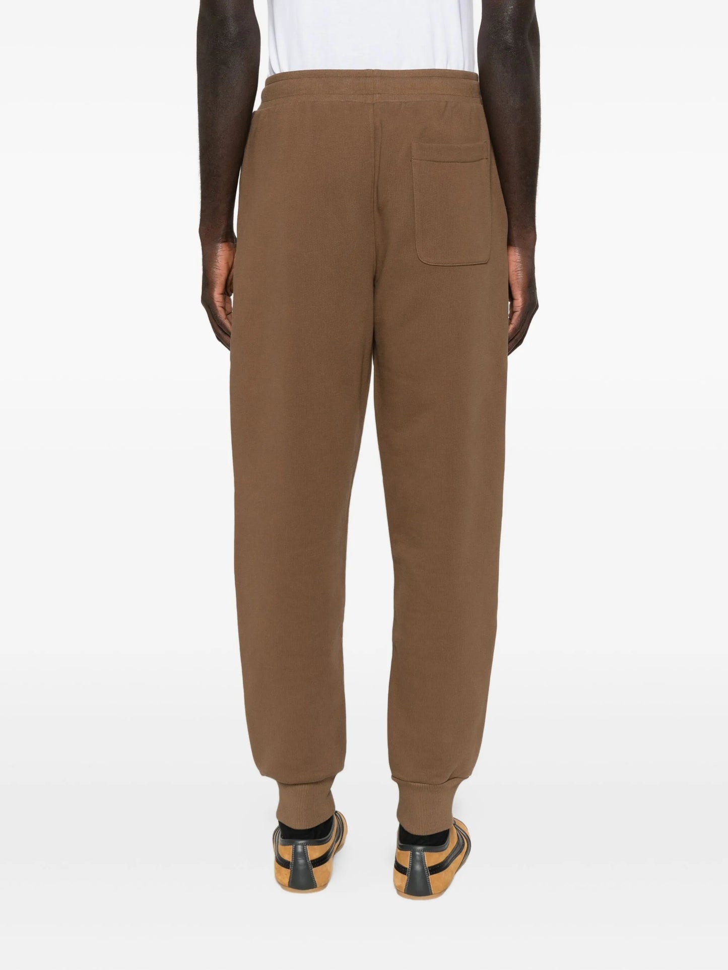 Brown sweatpants with a drawstring on a white background