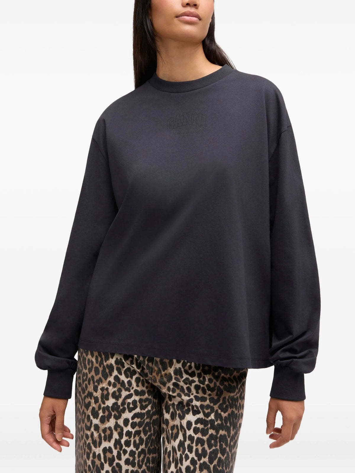 Black long-sleeve shirt with a brand logo on a white background