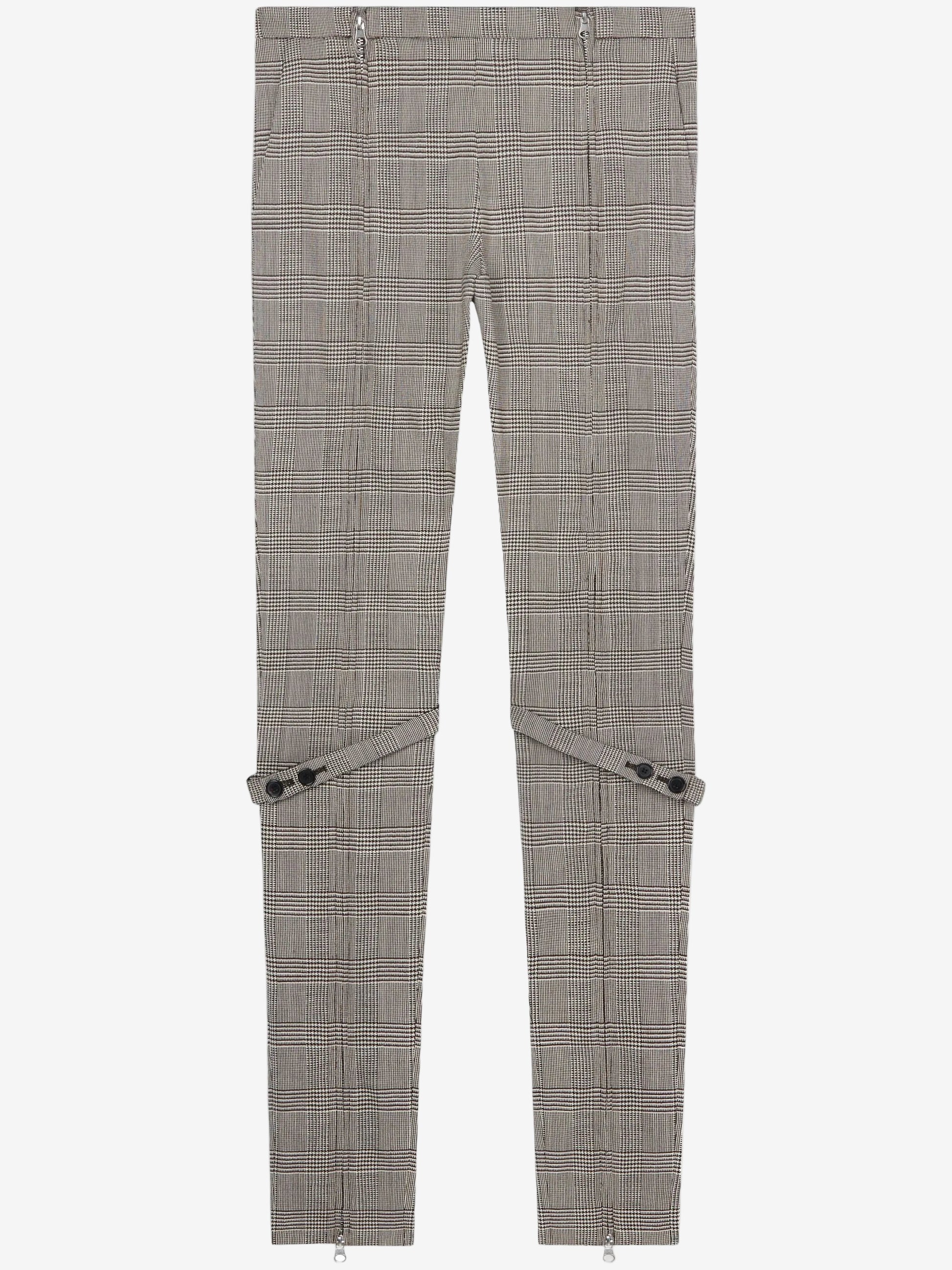 Gray checkered pants with zippers on a white background