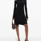 Black one-shoulder dress worn by a model on a white background