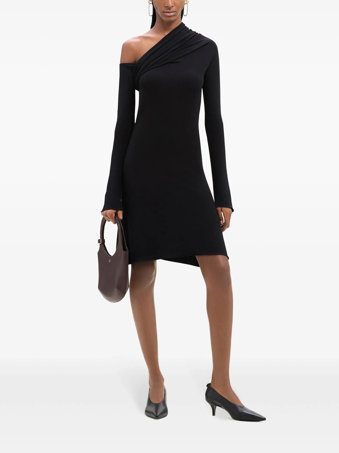 Black one-shoulder dress worn by a model on a white background
