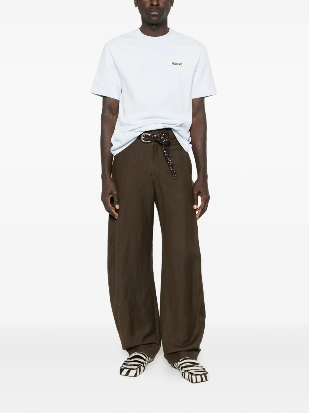 blue t-shirt with a small logo on a white background