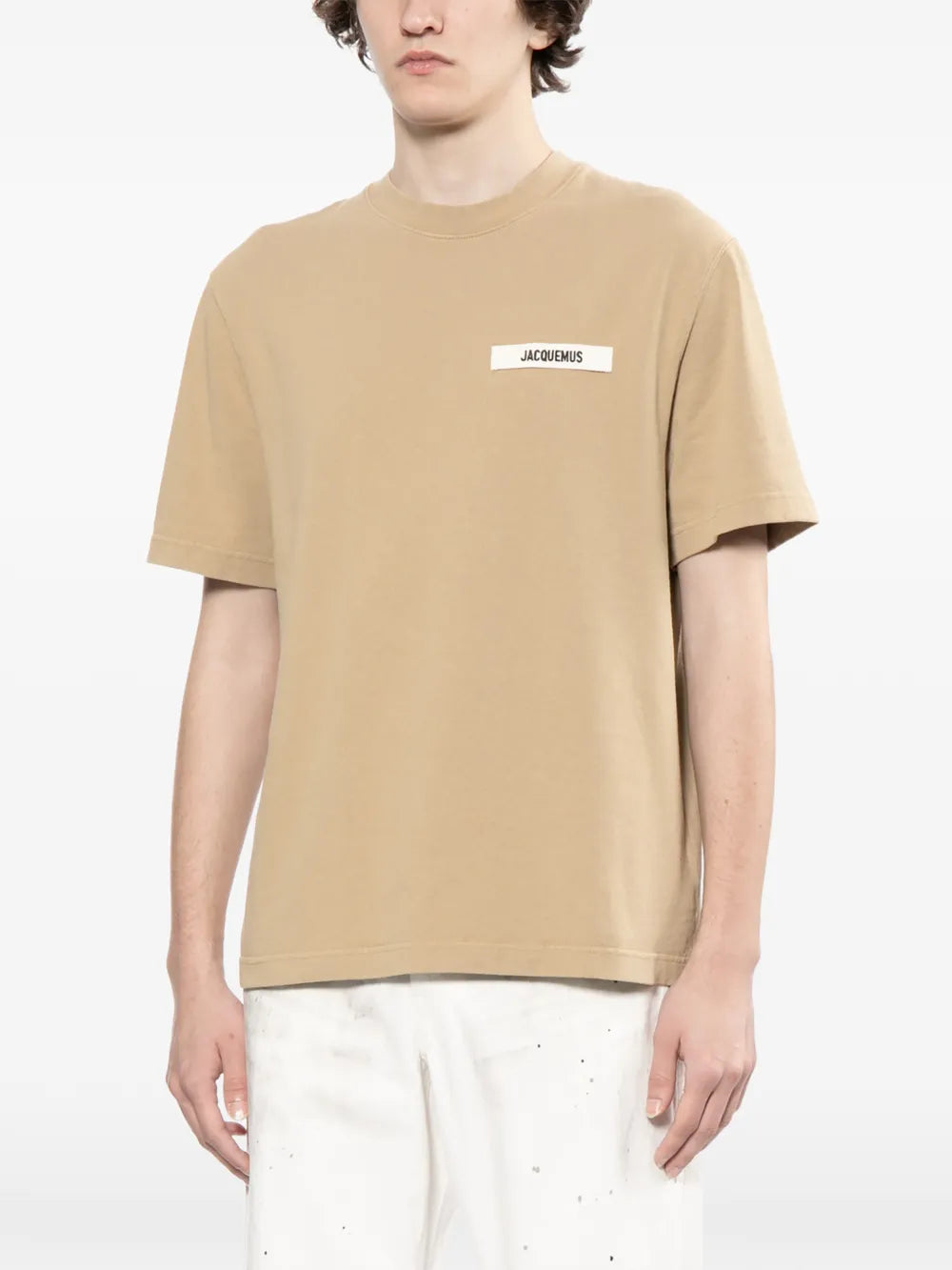 dark beige t-shirt with a small logo on a white background