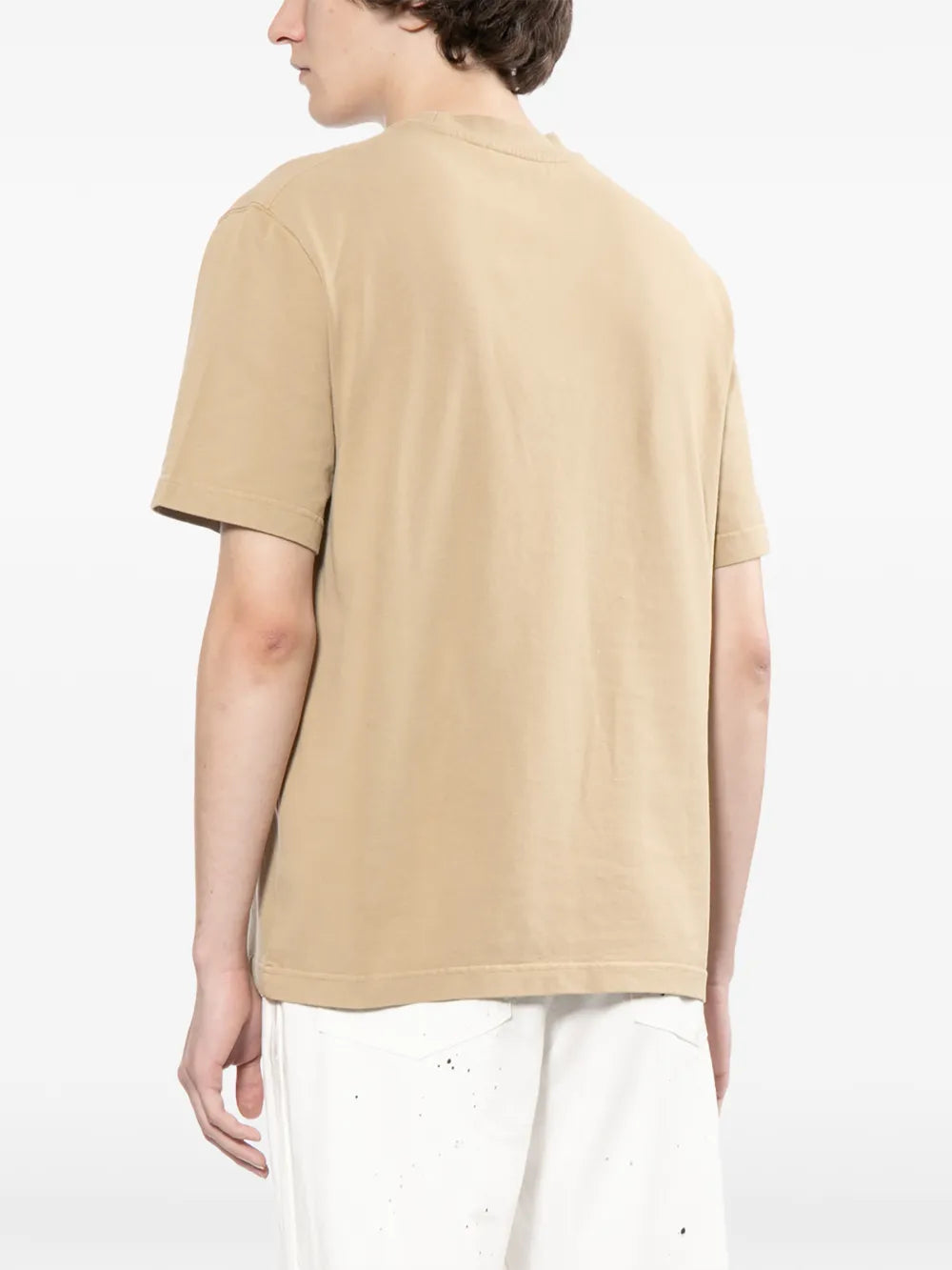 dark beige t-shirt with a small logo on a white background