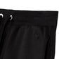 Black pants with drawstring on a white background