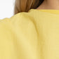 Yellow one-shoulder dress on a white background JACQUEMUS