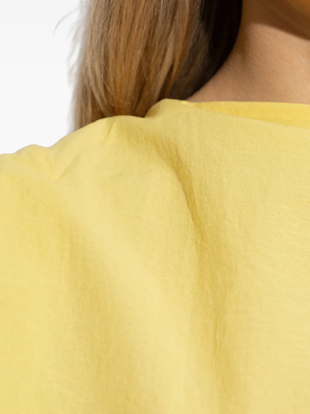 Yellow one-shoulder dress on a white background JACQUEMUS