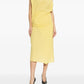 Yellow one-shoulder dress on a white background JACQUEMUS