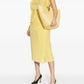 Yellow one-shoulder dress on a white background JACQUEMUS
