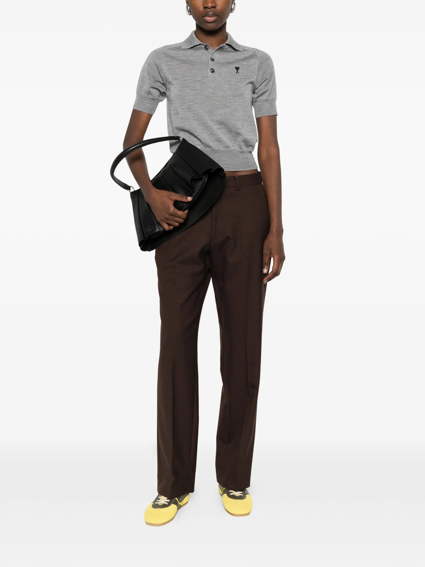 Gray polo shirt with a small logo on a white background