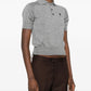Gray polo shirt with a small logo on a white background