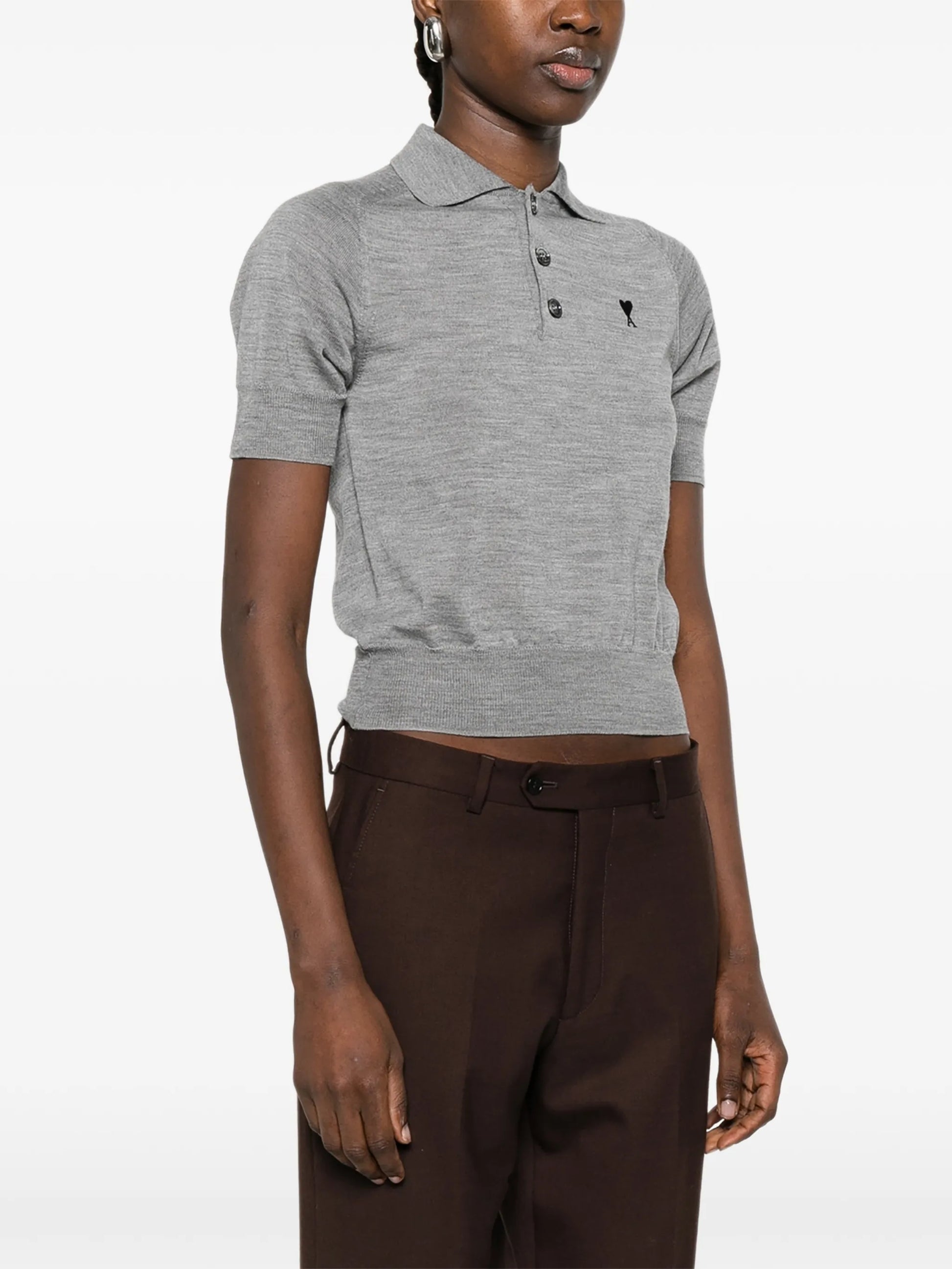 Gray polo shirt with a small logo on a white background