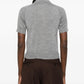 Gray polo shirt with a small logo on a white background