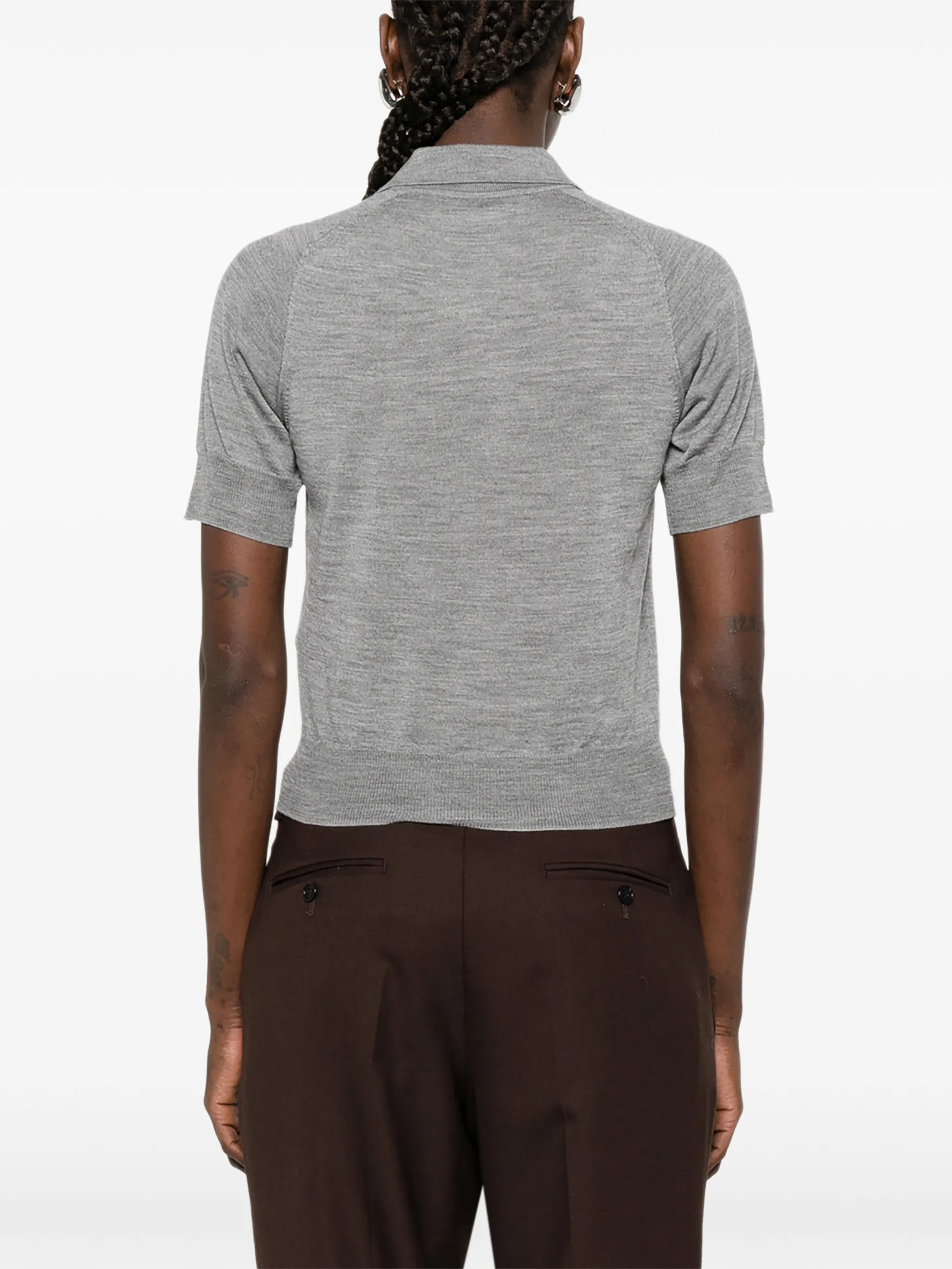 Gray polo shirt with a small logo on a white background