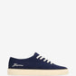 Navy blue sneaker with white laces on a white background