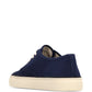 Navy blue sneaker with white laces on a white background