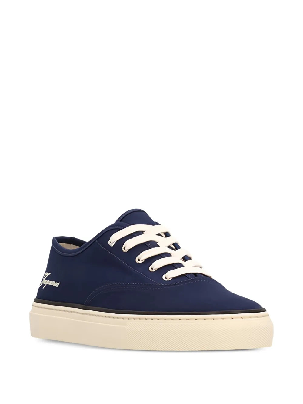 Navy blue sneaker with white laces on a white background