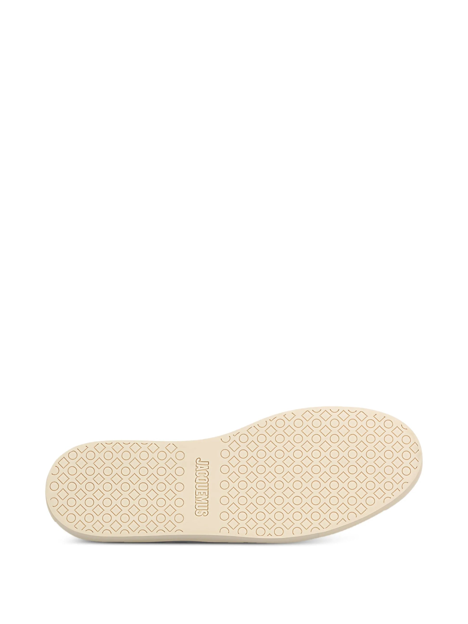 Navy blue sneaker with white laces on a white background