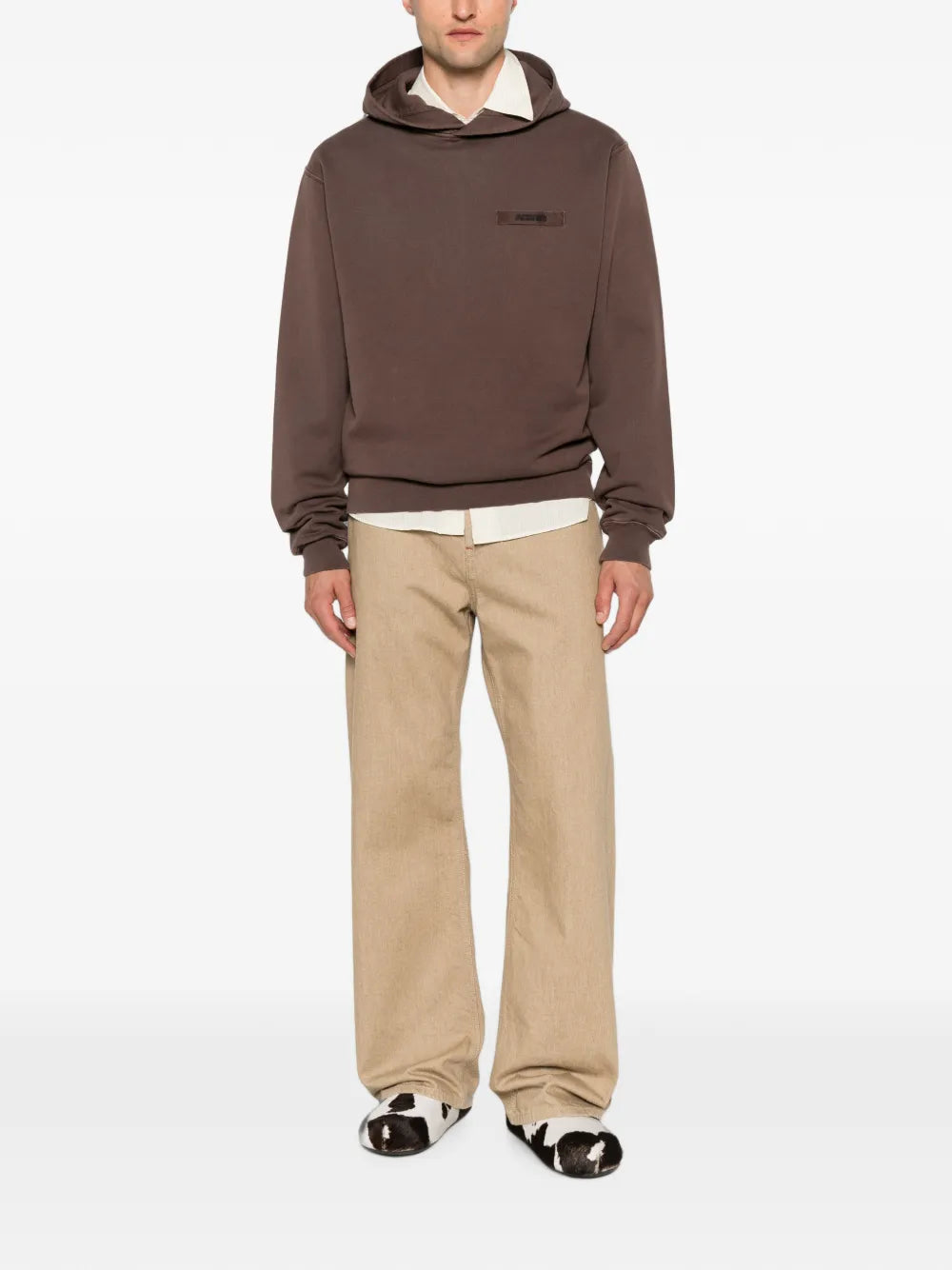 brown hoodie with a small logo on the chest against a white background