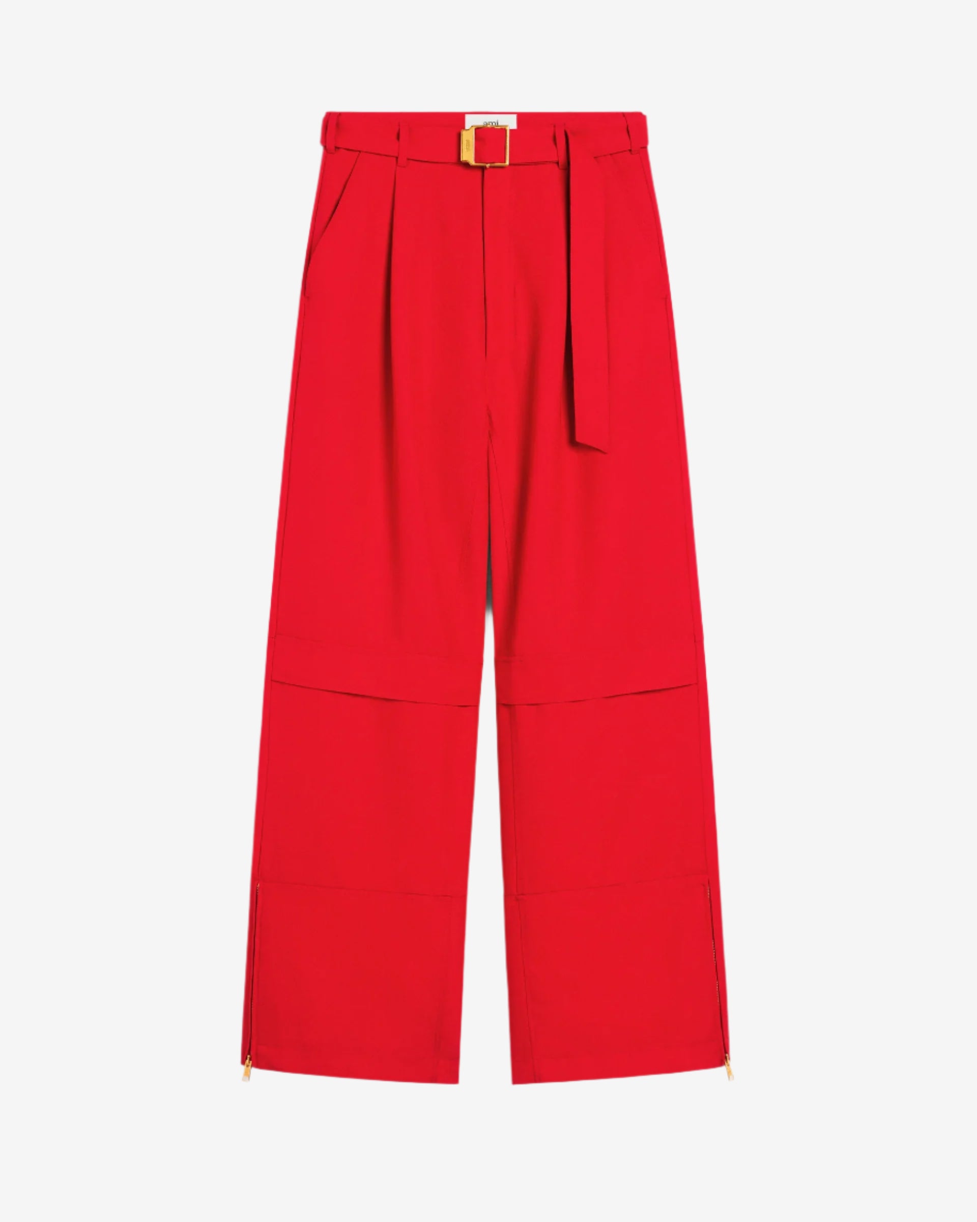 Red pants with a belt on a beige background