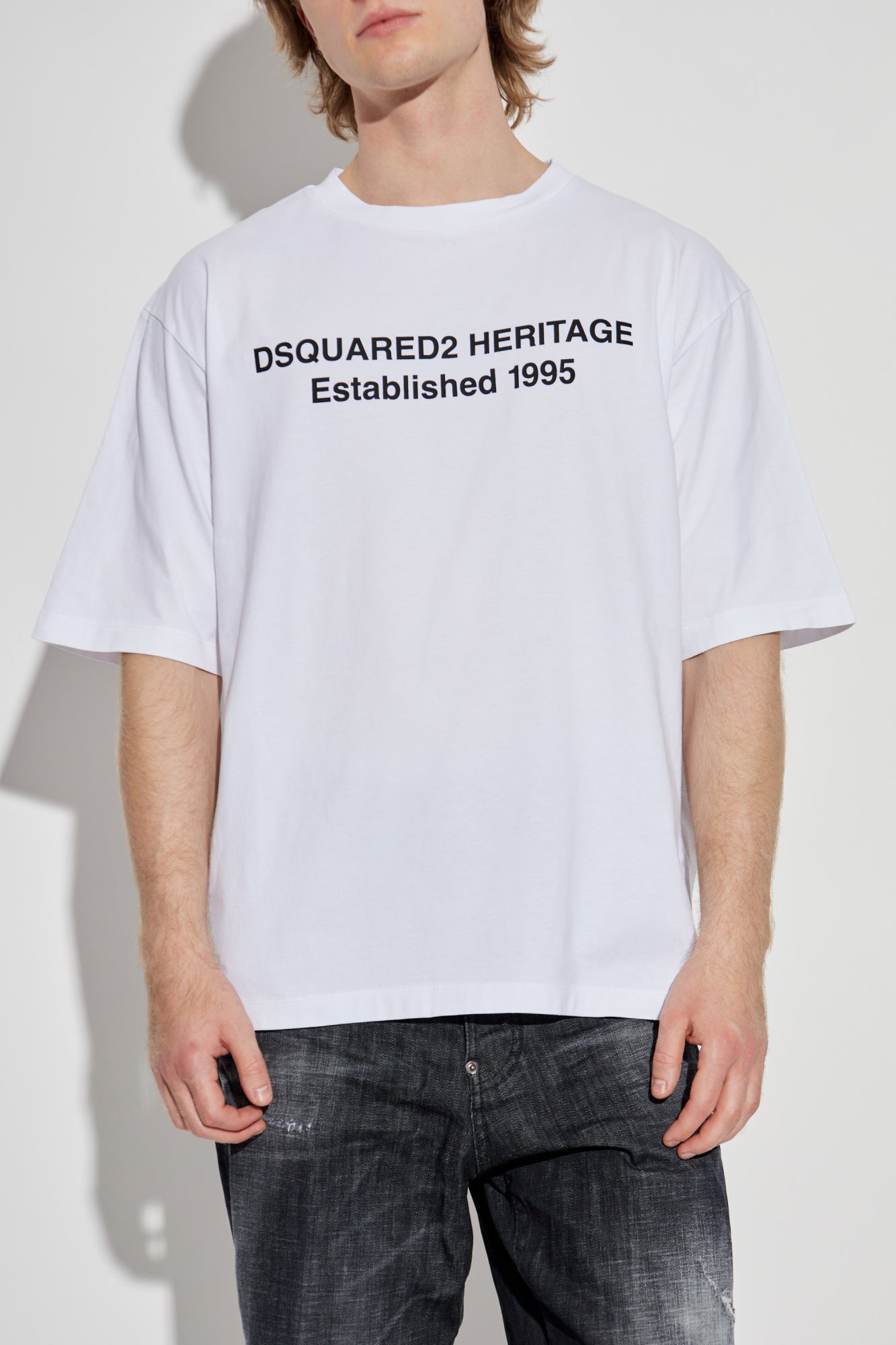 White t-shirt with black text on a white background