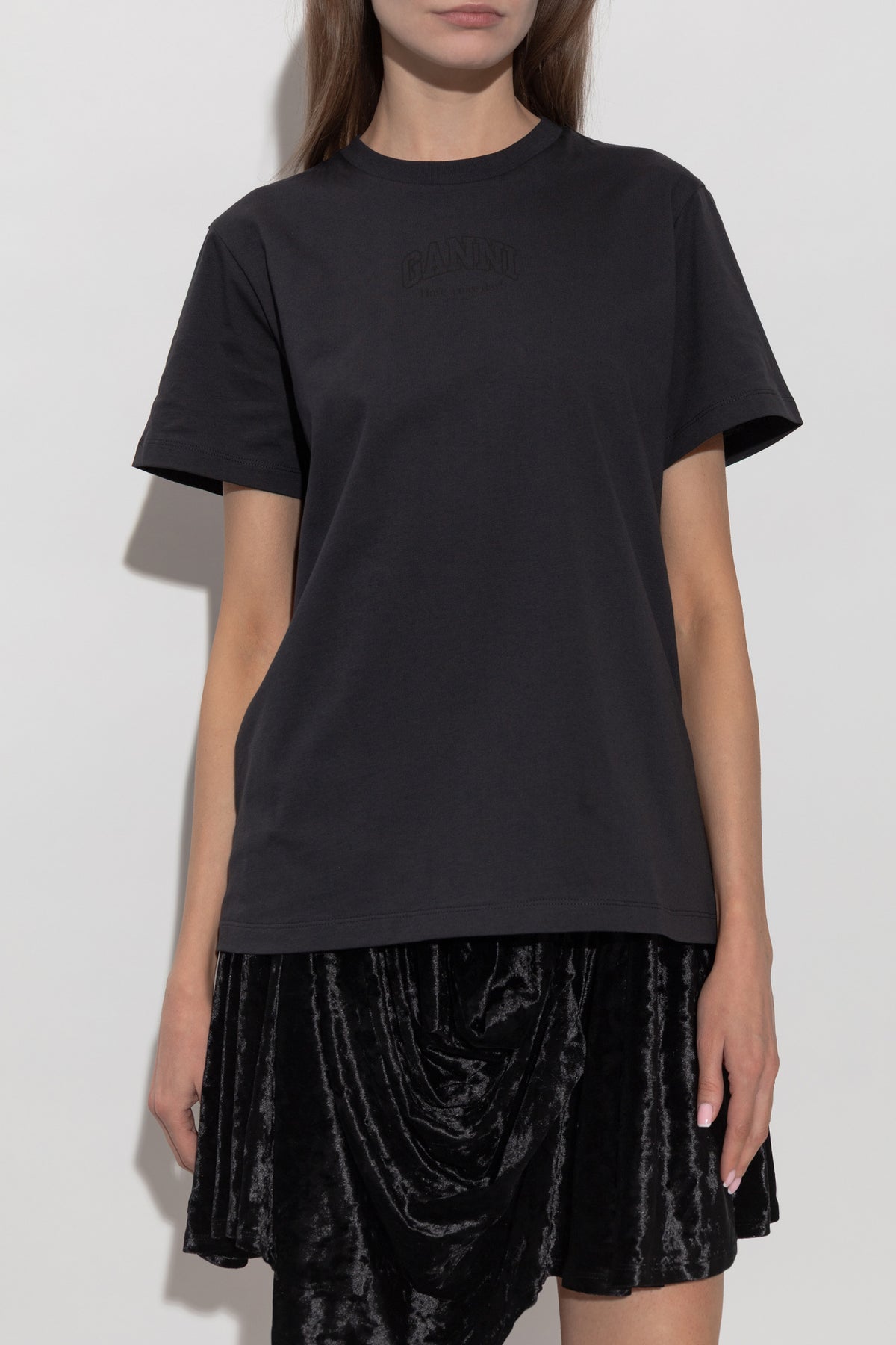 A black short-sleeve crewneck t-shirt by Maruti, shown flat against a plain white background.