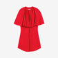 Red dress with a layered design on a beige background