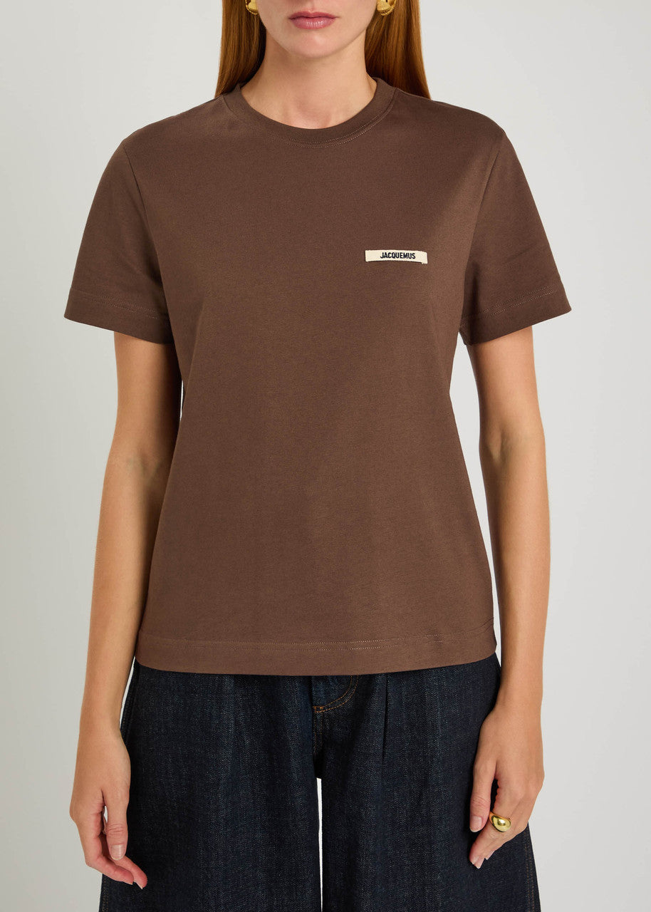brown t-shirt with a small logo on a white background JACQUEMUS