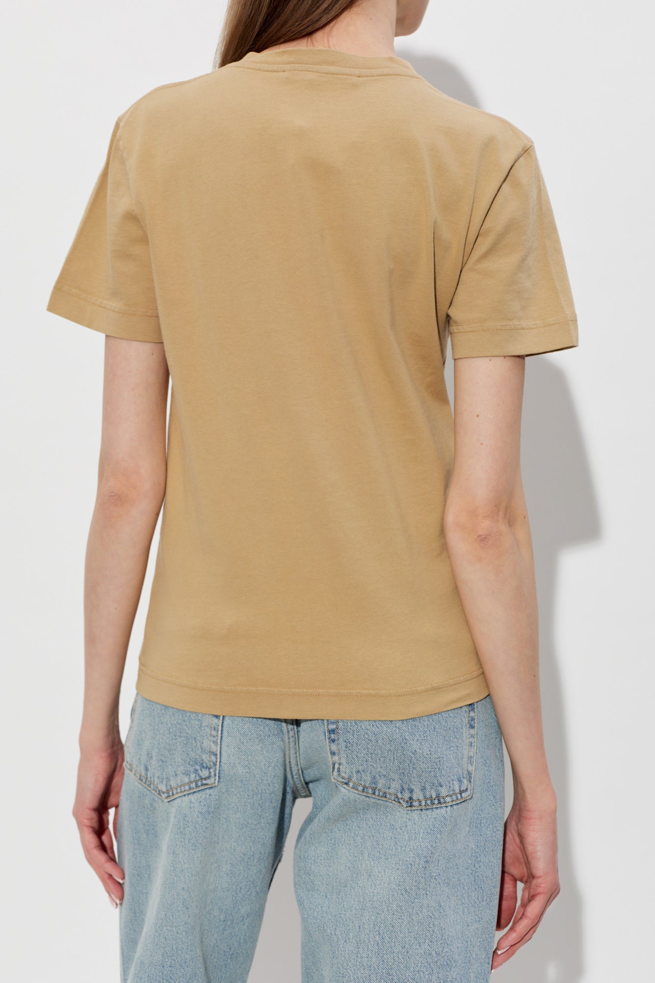 dark beige t-shirt with a small logo on a white background JACQUEMUS