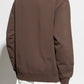 Brown sweatshirt with a small logo on a white background