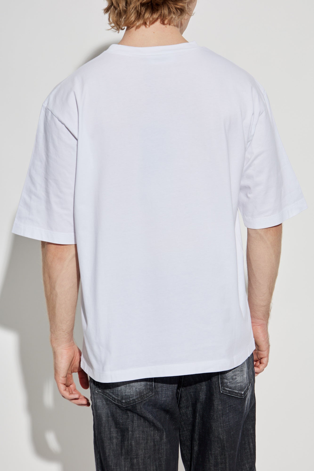 White t-shirt with black text on a white background