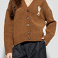 Brown cardigan with a heart and letter 'A' design on a white background ami paris