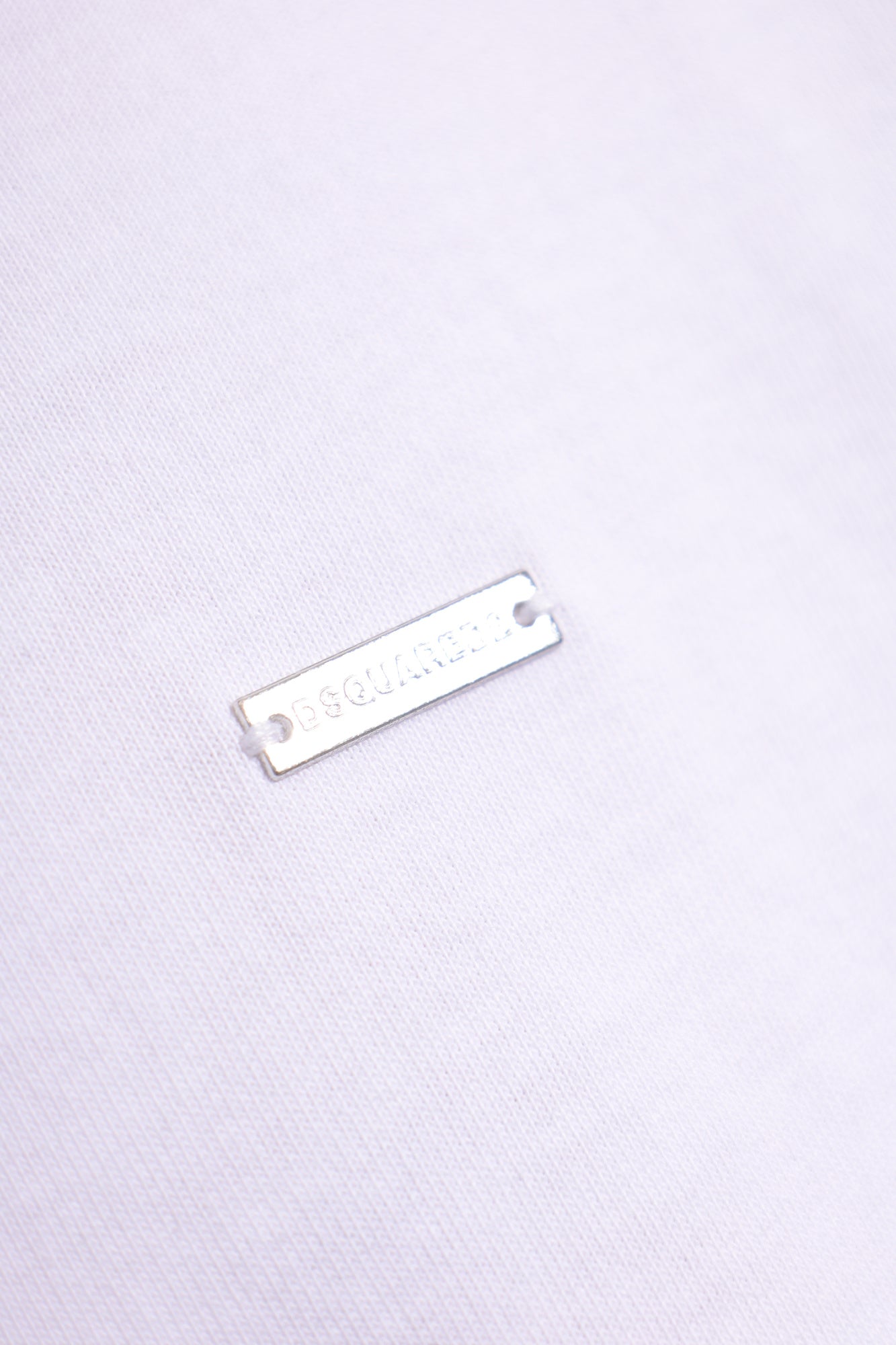 White t-shirt with a small logo on a white background DSQUARED2