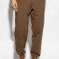Brown sweatpants with a drawstring on a white background