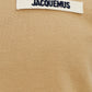 dark beige t-shirt with a small logo on a white background JACQUEMUS