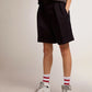 Women's shorts in black wool gabardine with waist belt