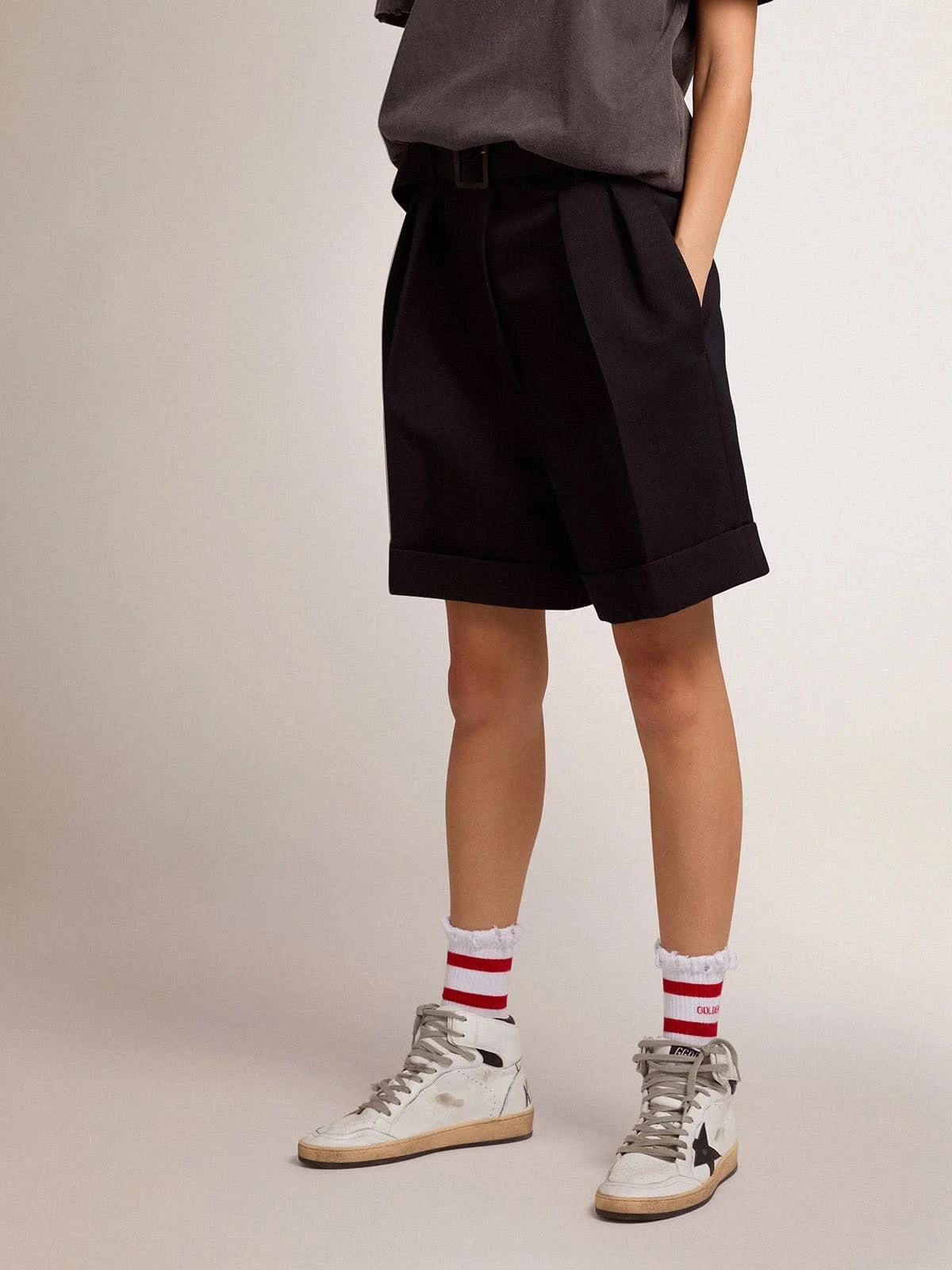 Women's shorts in black wool gabardine with waist belt