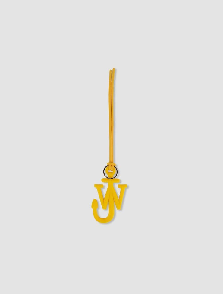 Yellow pendant with a unique design on a light gray background