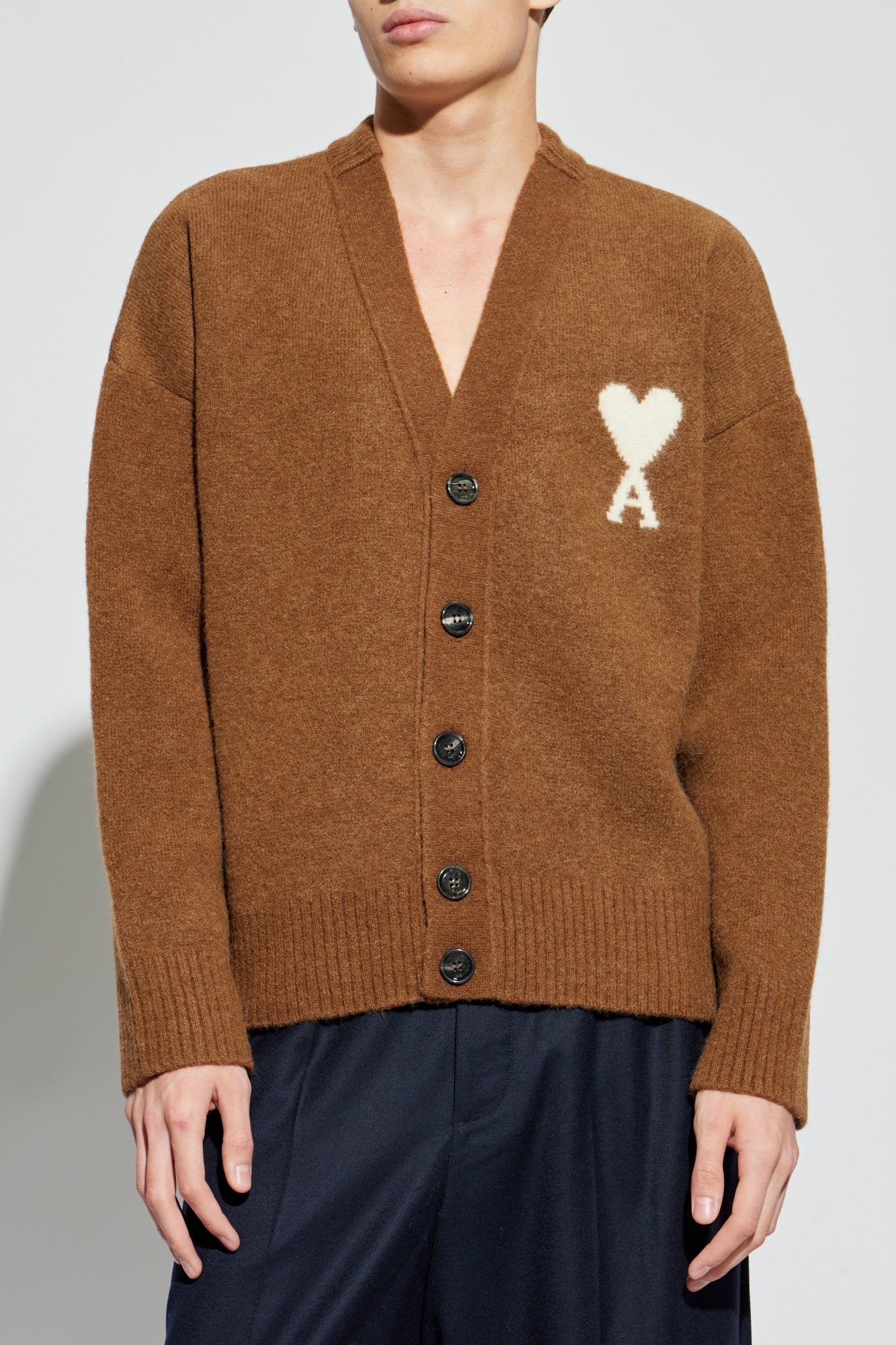 Brown cardigan with a heart and letter 'A' design on a white background ami paris
