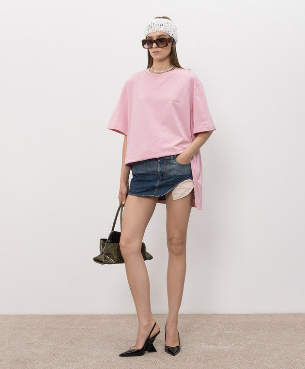 A light pink short-sleeve t-shirt with a small tonal pink ATTICO' logo on the left chest, displayed on a neutral light gray background.