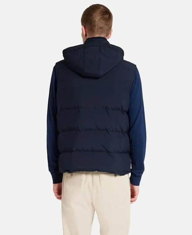Black puffer vest on a white background