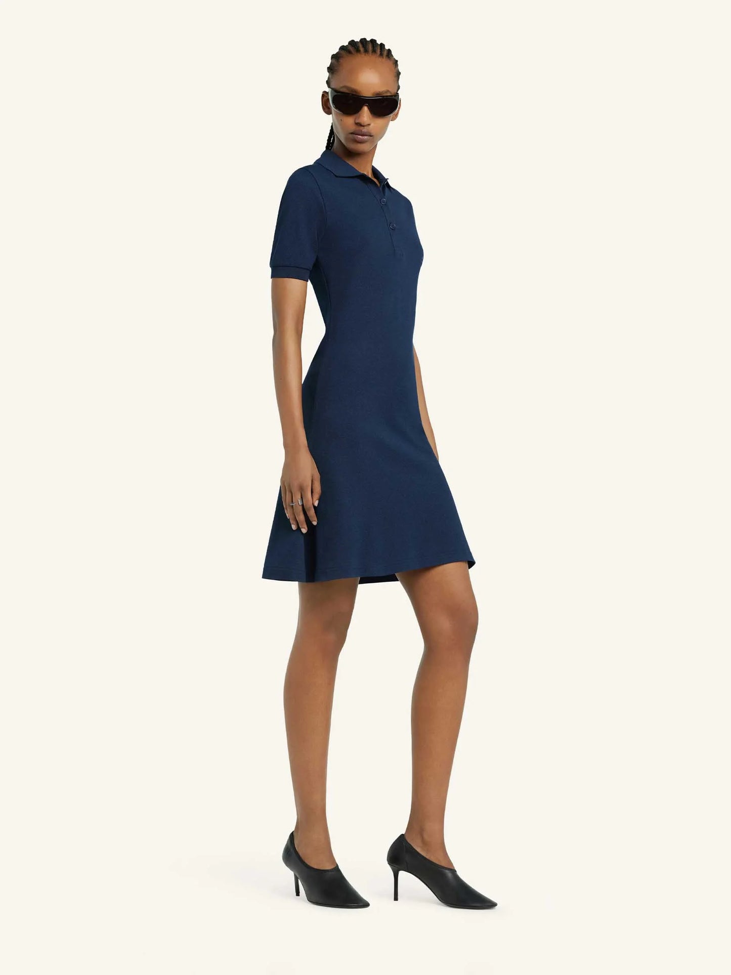 Navy blue dress with a collar on a white background