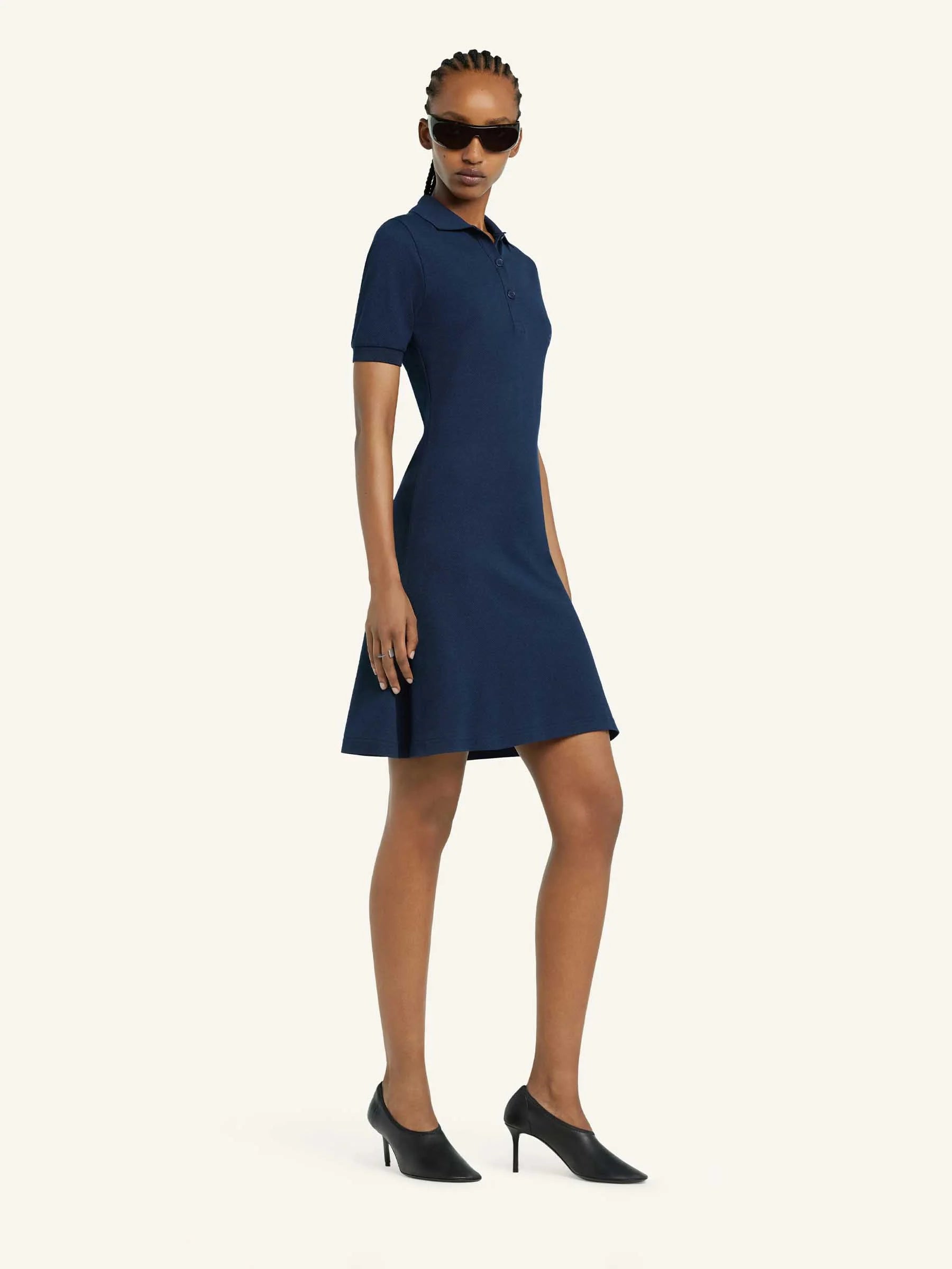 Navy blue dress with a collar on a white background