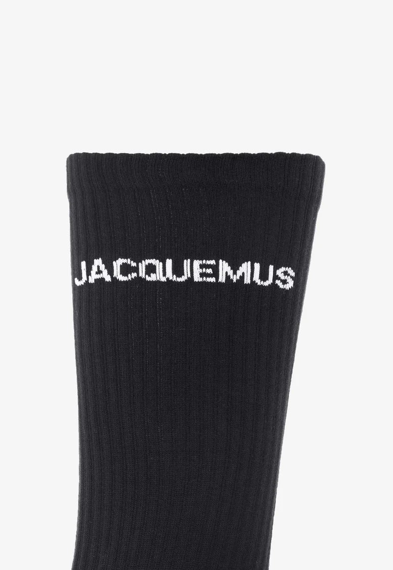 Black sock with 'Jacquemus' branding on a white background