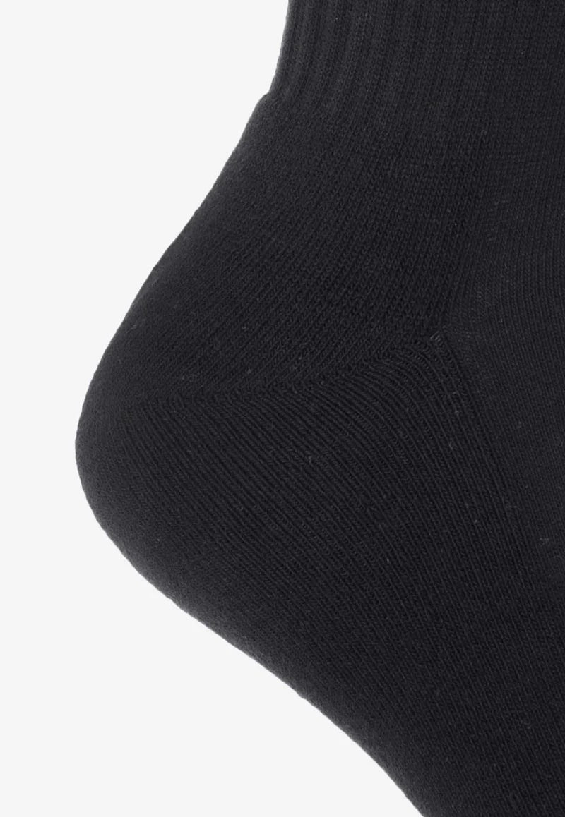 Black sock with 'Jacquemus' branding on a white background