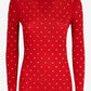 Red long-sleeve top with white polka dot pattern on a white background