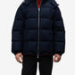 Man wearing a navy blue puffer jacket on a white background