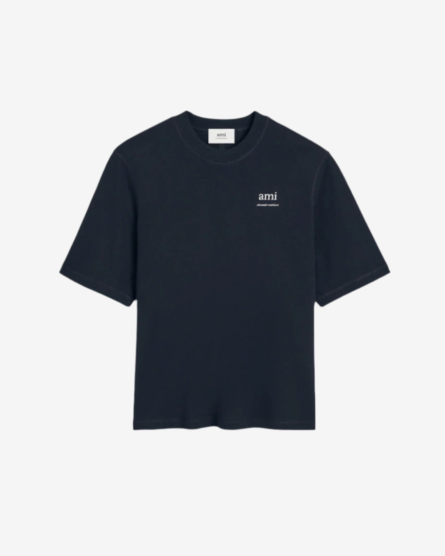 Navy blue t-shirt with 'ami' logo on a beige background ami paris